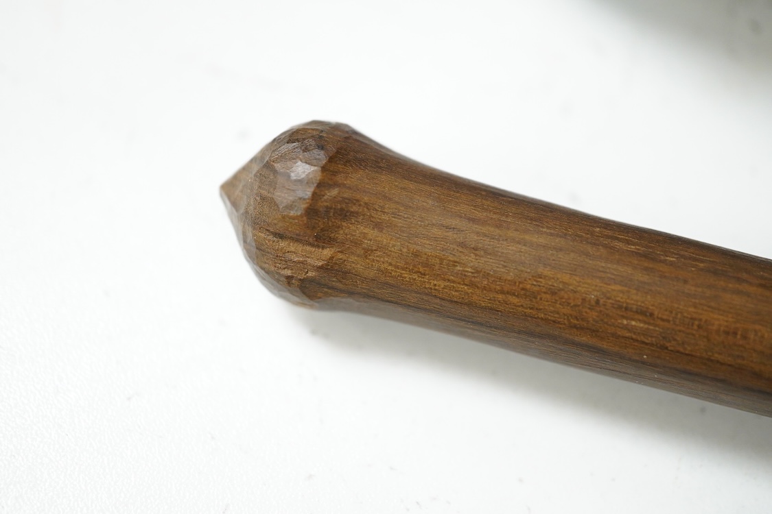 An African hardwood throwing club together with a painted mask and a Caucasian style dagger kindjal, largest 34cm high
